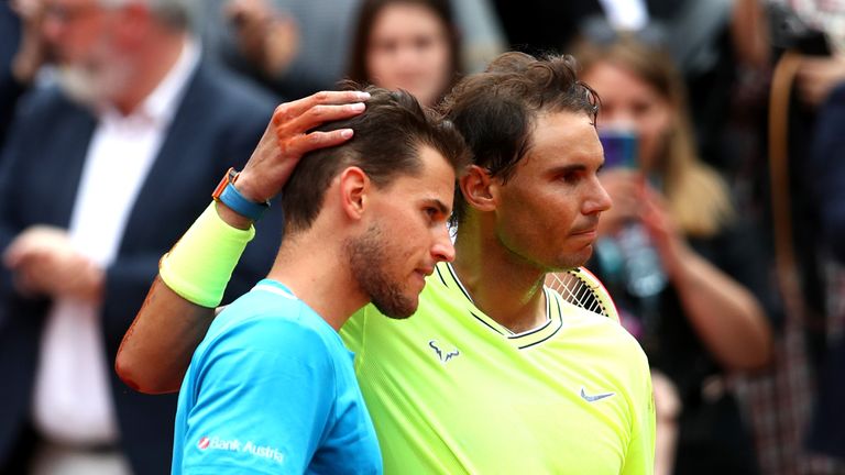 Rafael Nadal of Spain embraces Dominic Thiem of Austria following victory in the mens singles final during Day fifteen of the 2019 French Open at Roland Garros on June 09, 2019 in Paris, France.