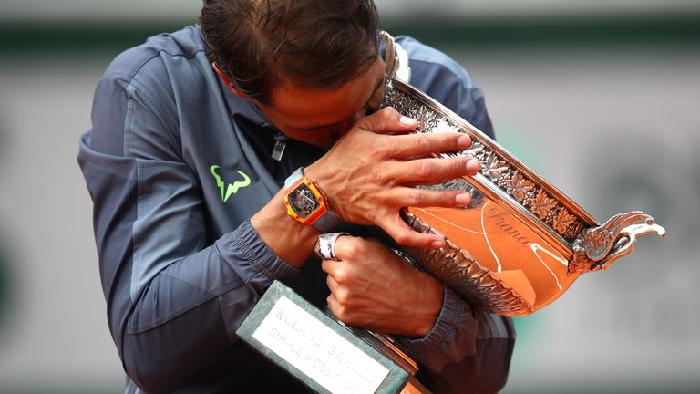 Rafael Nadal of Spain celebrates with the trophy following the mens singles final against Dominic Thiem of Austria during Day fifteen of the 2019 French Open at Roland Garros on June 09, 2019 in Paris, France. 