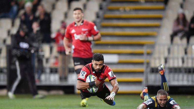 CHRISTCHURCH, NEW ZEALAND - JUNE 21: Richie Mo'unga of the Crusaders dives over to score a try during the Super Rugby Quarter Final match between the Crusaders and the Highlanders at Orangetheory Stadium on June 21, 2019 in Christchurch, New Zealand. (Photo by Kai Schwoerer/Getty Images)