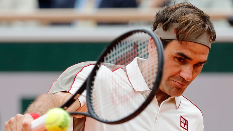 Switzerland's Roger Federer plays a backhand return to Spain's Rafael Nadal during their men's singles semi-final match on day 13 of The Roland Garros 2019 French Open tennis tournament in Paris on June 7, 2019