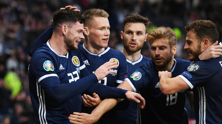 Scotland's Oliver Burke celebrates his late goal with team mates