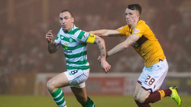 Celtic captain Scott Brown (left) battles with Motherwell&#39;s David Turnbull in their game at Fir Park