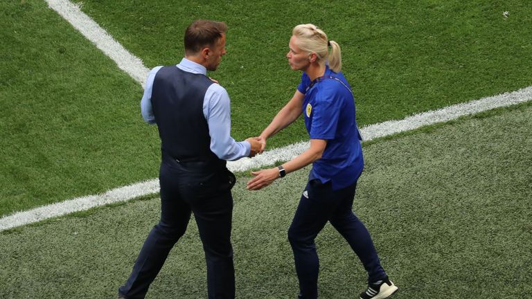 Phil Neville shakes hands with Shelley Kerr