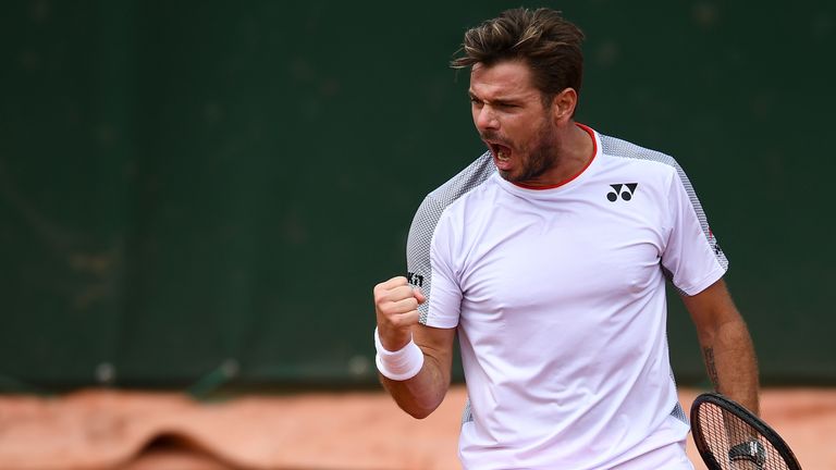 Switzerland's Stanislas Wawrinka reacts as he plays against Chile's Christian Garin during their men's singles second round match on day four of The Roland Garros 2019 French Open tennis tournament in Paris on May 29, 2019.