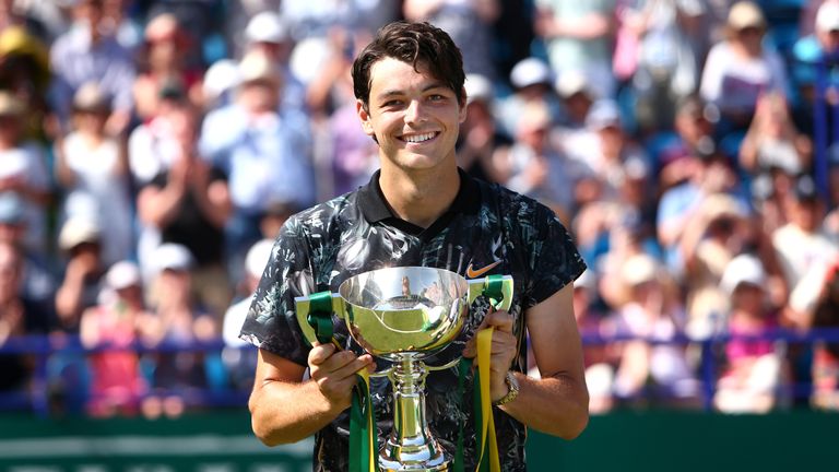 Taylor Fritz celebrates winning his first tour-level title