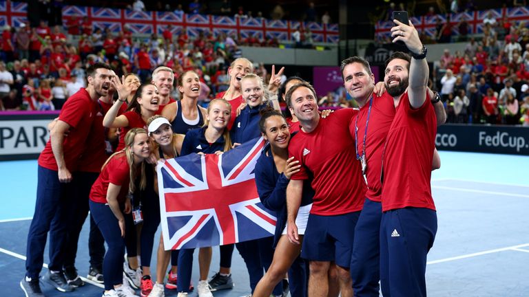 The Great Britain staff and players celebrate the team's win and qualification during the Fed Cup World Group II Play-Off match between Great Britain and Kazakhstan