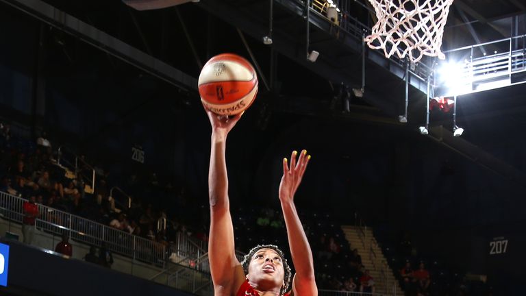 Tianna Hawkins #21 of the Washington Mystics drives to the basket during the game against Kaela Davis #3 of Dallas Wings on June 9, 2019 at the St. Elizabeths East Entertainment and Sports Arena in Washington,