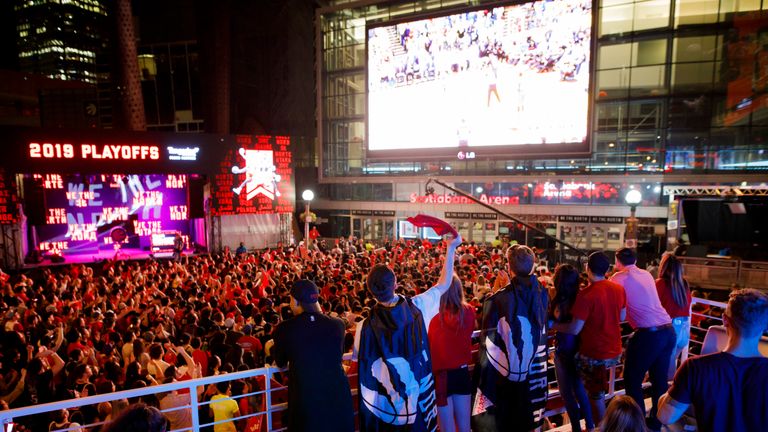 Toronto Raptors fans gather to watch Game 4 of the NBA Finals series outside Scotiabank Arena at 'Jurassic Park', on June 7, 2019 in Toronto, Canada.