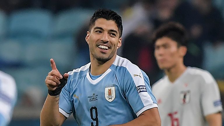 Luis Saurez scored from the penalty spot in Uruguay's 2-2 draw with Japan