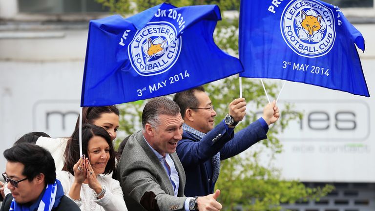 Leicester City manager Nigel Pearson and owner Vichai Srivaddhanaprabha ride in an open top bus through the city centre during a victory parade in honour of the football club winning the SkyBet Championship League trophy on May 5, 2014 in Leicester, England.