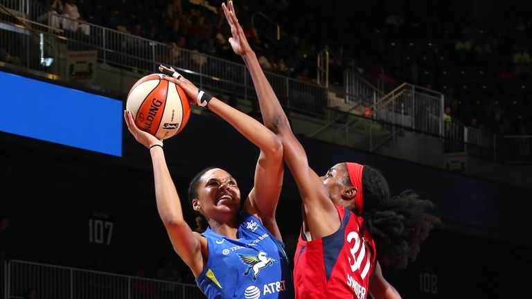 Azurá Stevens #30 of Dallas Wings looks to pass the ball during the game against LaToya Sanders #30 of the Washington Mystics on June 9, 2019 at the St. Elizabeths East Entertainment and Sports Arena in Washington, DC.