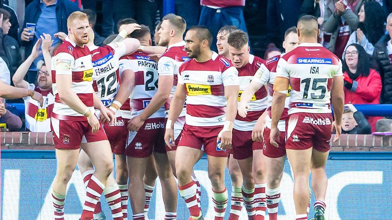 Wigan celebrate after Partington's score put them back in front 