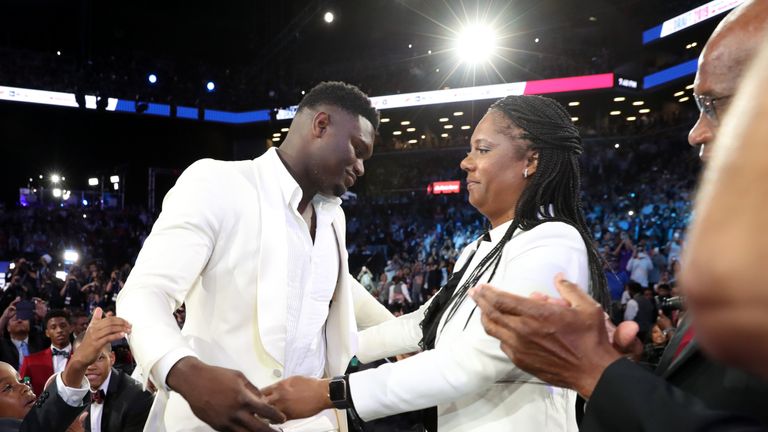 Zion Williamson celebrates with family after being selected first overall by the New Orleans Pelicans during the 2019 NBA Draft on June 20, 2019 at the Barclays Center in Brooklyn, New York.