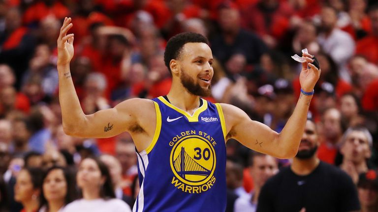 Stephen Curry celebrates the Golden State Warriors&#39; narrow victory in Game 5 of the NBA Finals.