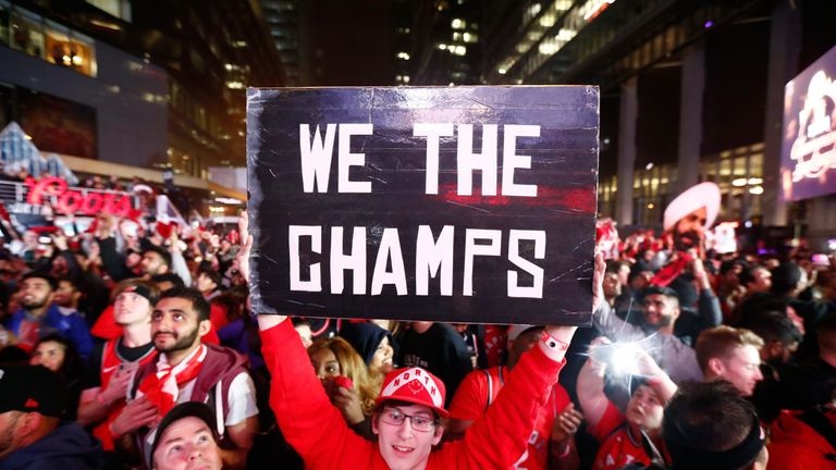 Toronto Raptors fans celebrate their team's maiden NBA title win in Jurassic Park