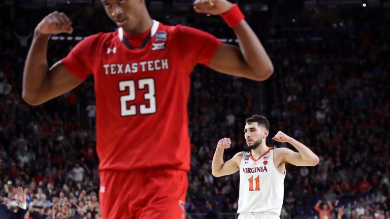 Ty Jerome celebrates during a Virginia victory