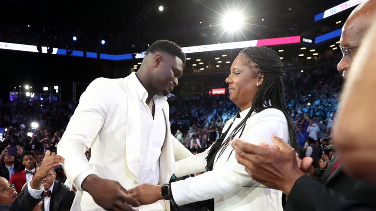 An emotional Zion Williamson embraces his mother after being selected with the first pick