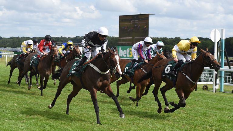 Silvestre de Sousa on board Bettys Hope (Black and white top, white hat) wins the Weatherbys Super Sprint Stakes from Paddy Mathers on board Show Me Show Me at Newbury Racecourse. PRESS ASSOCIATION Photo. Picture date: Saturday July 20, 2019. See PA story RACING Newbury. Photo credit should read: Daniel Hambury/PA Wire. 