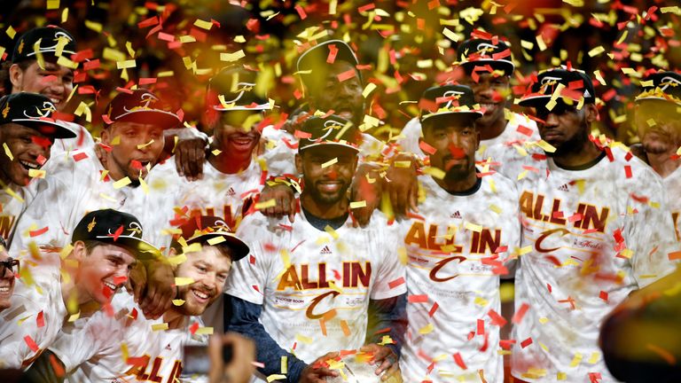 Joe Harris (left, bottom row) celebrates the Cleveland Cavaliers 2016 NBA title win along with Kyrie Irving