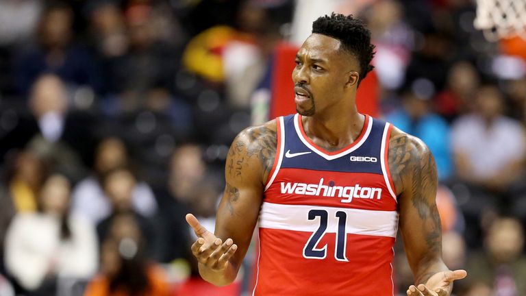 Dwight Howard questions a call during a rare Wizards appearance