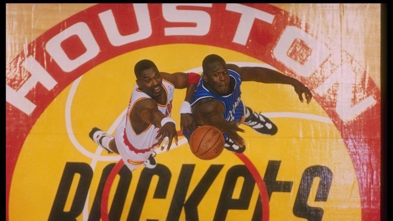 Hakeem Olajuwon and Shaquille O'Neal compete for a jump-ball