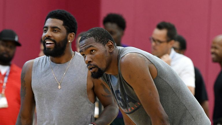Kyrie Irving and Kevin Durant share a joke at the 2019 All-Star weekend