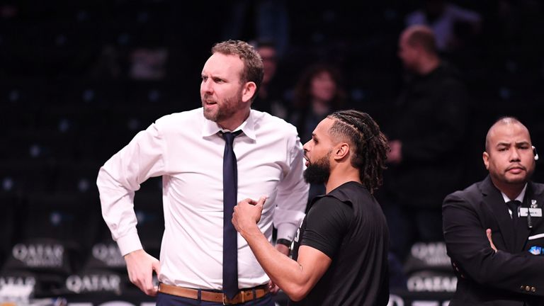 Nets general manager Sean Marks pictured on court at Barclays Center