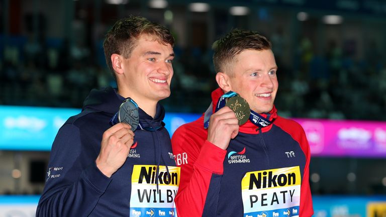 James Wilby (left) and Peaty pose with their medals