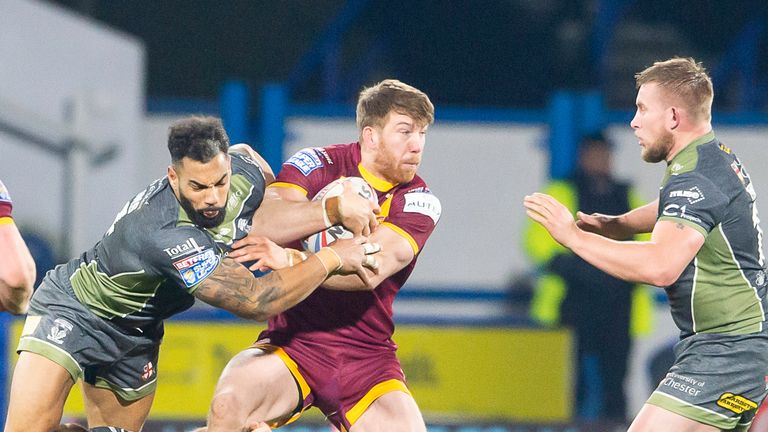 Picture by Allan McKenzie/SWpix.com - 22/02/2019 - Rugby League - Betfred Super League - Huddersfield Giants v Warrington Wolves - John Smith's Stadium, Huddersfield, England - Adam Walne is tackled by Ryan Atkins.