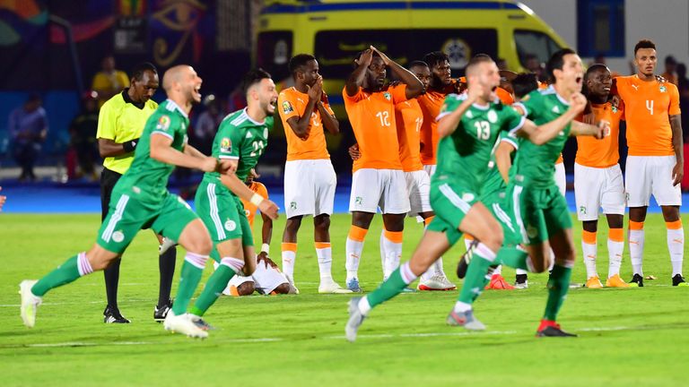 Algerian players celebrate after winning their AFCON quarter-final clash with the Ivory Coast