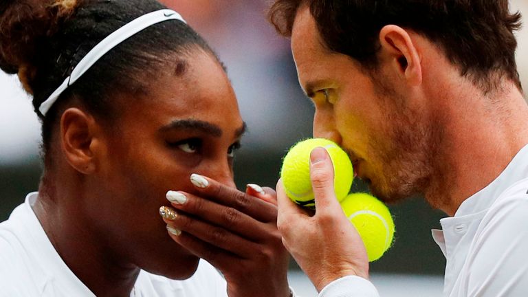 Andy Murray (R) and US player Serena Williams (L) speak between points against France's Fabrice Martin and US player Raquel Atawo during their mixed doubles second round match on day eight of the 2019 Wimbledon Championships at The All England Lawn Tennis Club in Wimbledon, southwest London, on July 9, 2019.
