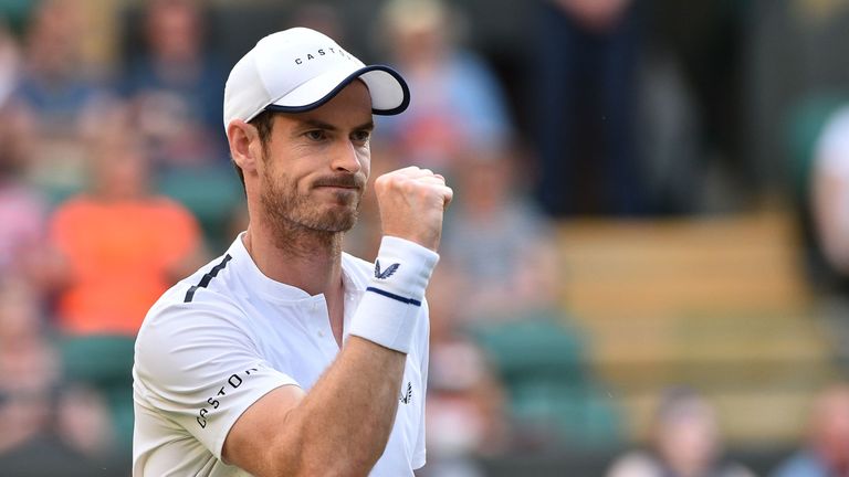 Andy Murray celebrates after winning a point against Romania's Marius Copil and France's Ugo Humbert during their men's doubles second round match on the fourth day of the 2019 Wimbledon Championships at The All England Lawn Tennis Club in Wimbledon, southwest London, on July 4, 2019.