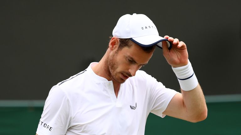 Andy Murray of Great Britain, playing partner of Pierre-Hugues Herbert of France looks dejected in their Men's Doubles second round match against Nikola Mektic of Croatia and Franko Skugor of Croatianduring Day six of The Championships - Wimbledon 2019 at All England Lawn Tennis and Croquet Club on July 06, 2019 in London, England.