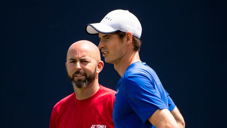 Andy Murray of Great Britain with coach Jamie Delgado during doubles practices with Ivan Dodig of Croatia during day 1 of the Fever-Tree Championships at Queens Club on June 17, 2019 in London, United Kingdom. 
