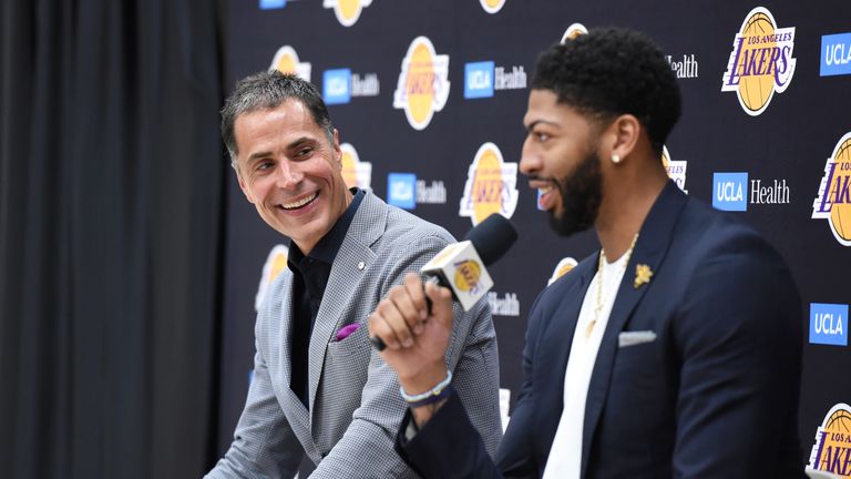 Lakers GM Rob Pelinka looks on as Anthony Davis answers a question