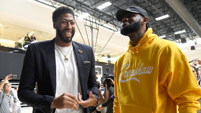 Anthony Davis (L) talks with LeBron James