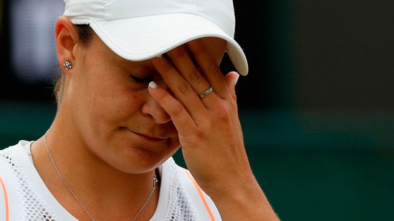 Australia's Ashleigh Barty reacts after losing a point against US player Alison Riske during their women's singles fourth round match on the seventh day of the 2019 Wimbledon Championships at The All England Lawn Tennis Club in Wimbledon, southwest London, on July 8, 2019.