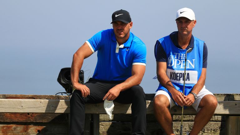 Brooks Koepka and his caddie Ricky Elliott during a practice round ahead of The Open at Royal Portrush