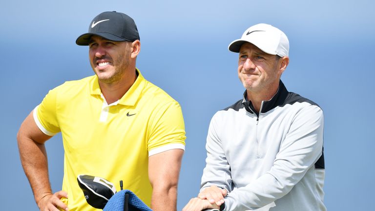 Brooks Koepka and his caddie Ricky Elliott during a practice round ahead of The Open at Royal Portrush