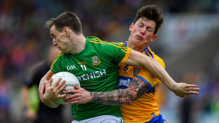 Bryan McMahon of Meath in action against Aaron Fitzgerald of Clare