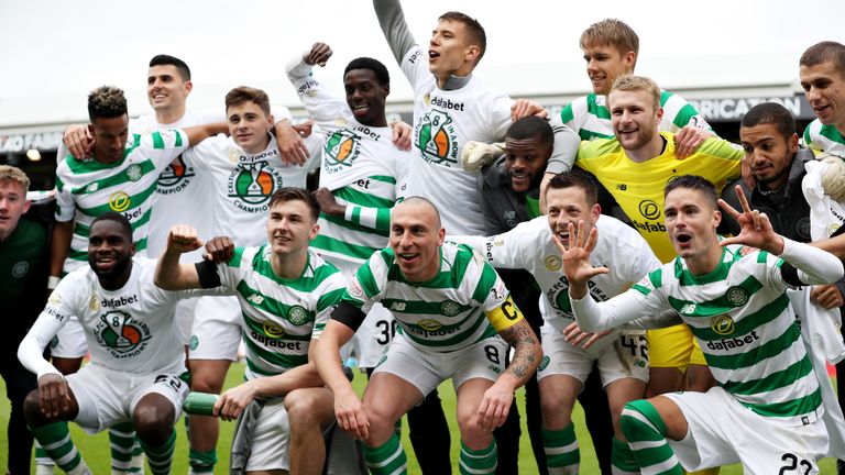 The Celtic team celebrate winning the Scottish Premiership title last season.