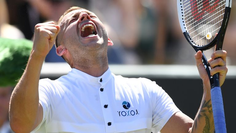 Dan Evans celebrates after beating Georgia's Nikoloz Basilashvili during their men's singles second round match on the fourth day of the 2019 Wimbledon Championships at The All England Lawn Tennis Club in Wimbledon, southwest London, on July 4, 2019. 