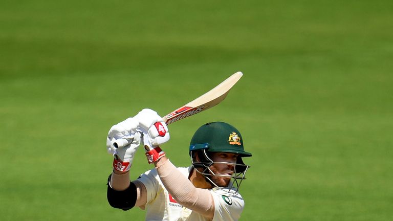 David Warner drives through the off-side in Australia's warm-up match ahead of the Ashes