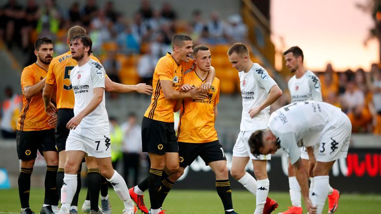 Diogo Jota is congratulated after firing Wolves into the lead