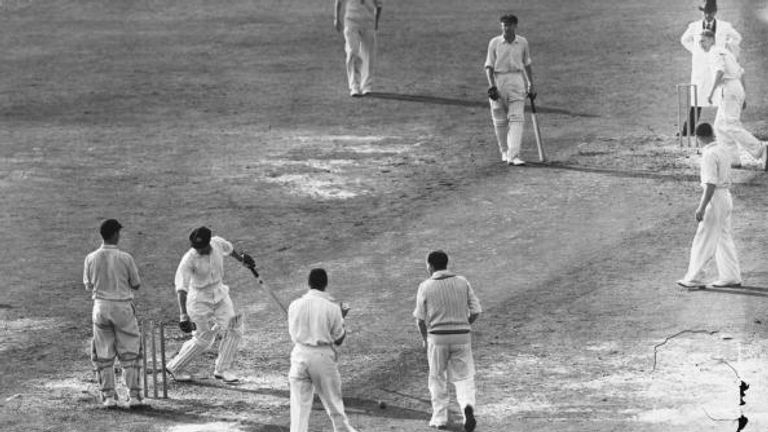 Needing just four runs to finish his Test career with a batting average of 100, Don Bradman is bowled second ball by Eric Hollies at The Oval.