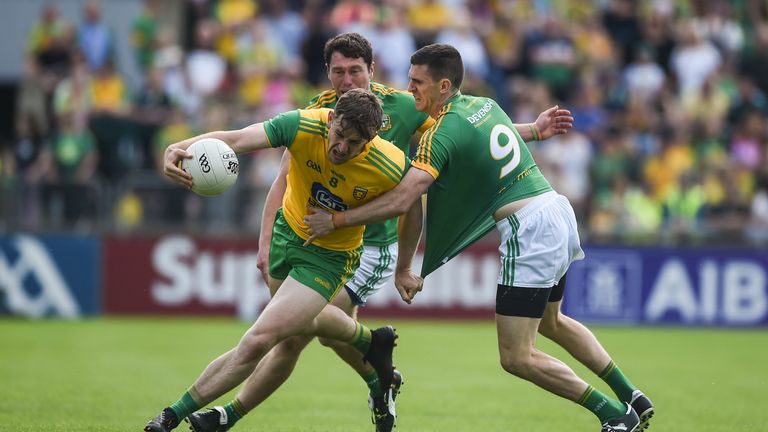 Hugh McFadden of Donegal in action against Shane McEntee of Meath