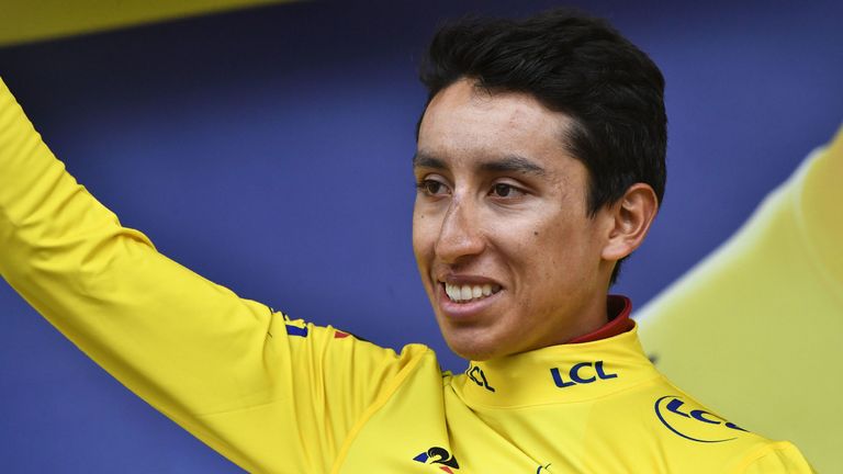 Colombia's Egan Bernal waves as he celebrates his overall leader's yellow jersey on the podium of the nineteenth stage of the 106th edition of the Tour de France cycling race between Saint-Jean-de-Maurienne and Tignes, in Tignes, on July 26, 2019. (Photo by JEFF PACHOUD / AFP) (Photo credit should read JEFF PACHOUD/AFP/Getty Images)