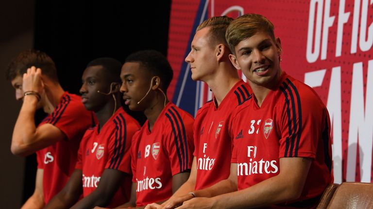 Emile Smith Rowe (right) joins team-mates at a pre-season event