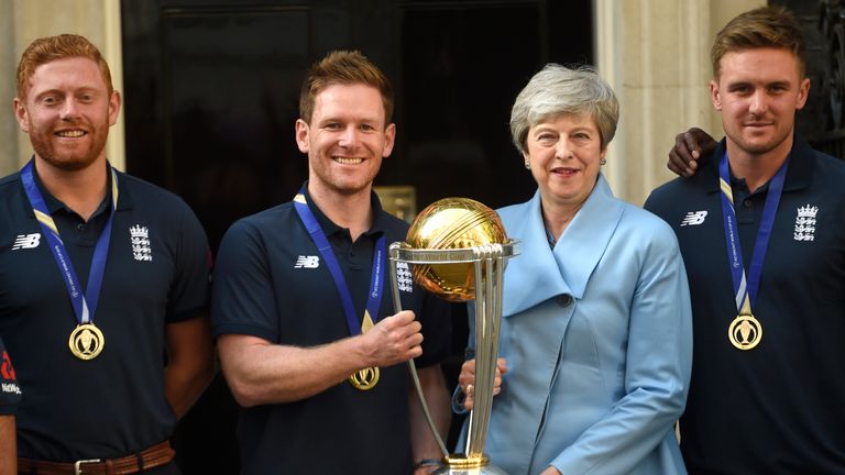Eoin Morgan and Theresa May with the Cricket World Cup trophy
