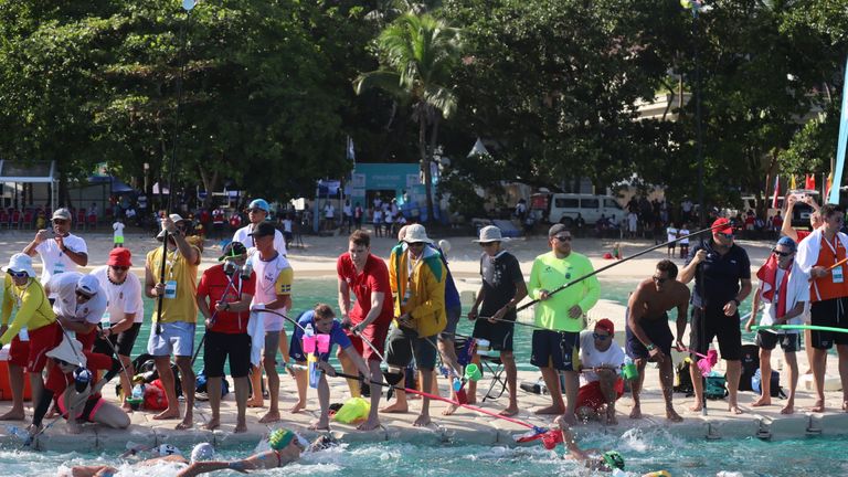 The feeding station was a frenzied part of the 10K Open Water race